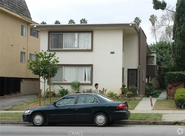 a car parked in front of a house