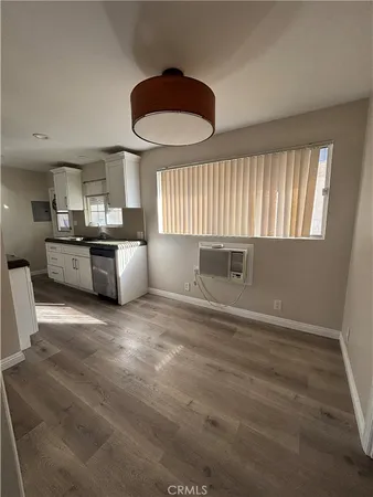 a view of kitchen with furniture and window