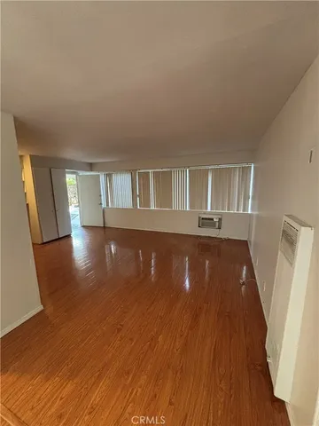 a view of livingroom with wooden floor and staircase
