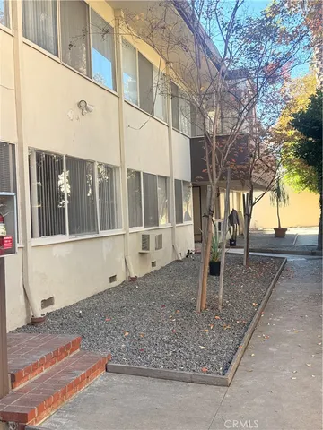 a house with trees in front of it