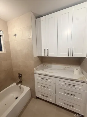 a bathroom with a sink and a bathtub