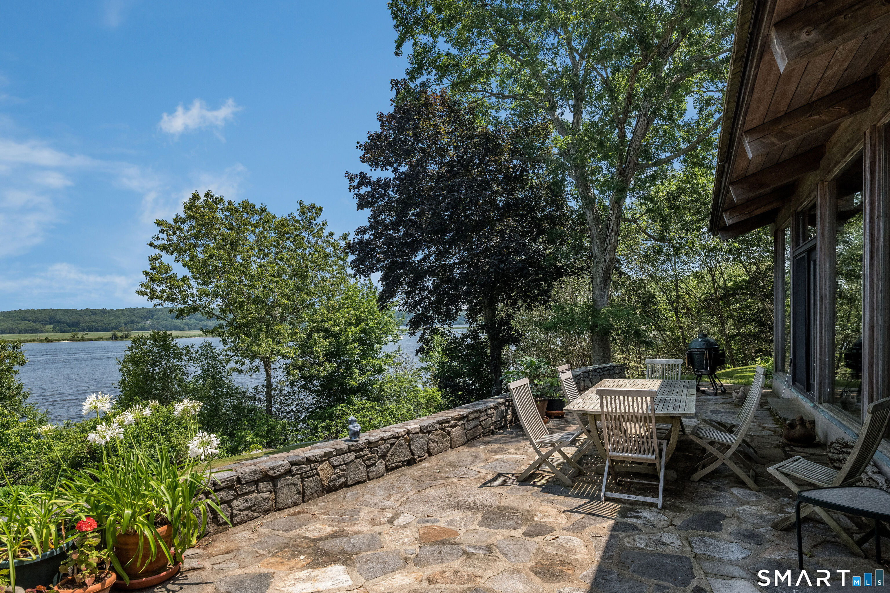 41 Watrous Point Road Old Saybrook, CT 06475 - Photo 13 of 40 a view of a lounge chair and table in the patio