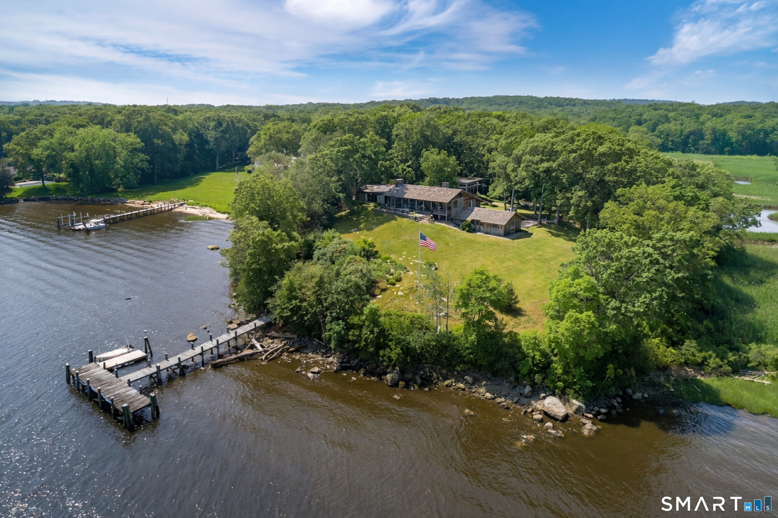 41 Watrous Point Road Old Saybrook, CT 06475 - Photo 2 of 40 an aerial view of a house with a yard basket ball court and outdoor seating
