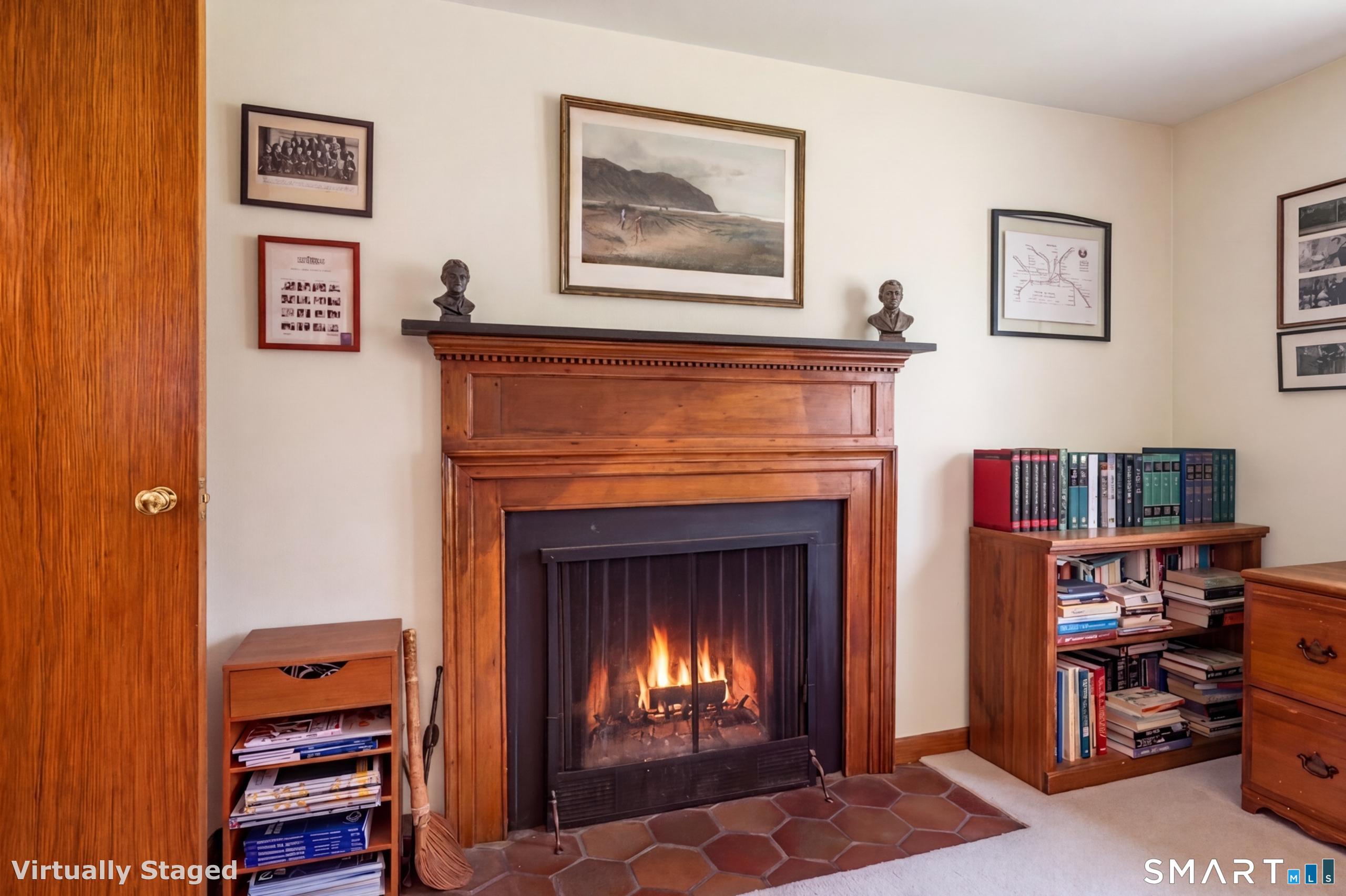 41 Watrous Point Road Old Saybrook, CT 06475 - Photo 25 of 40 a living room with furniture and a fireplace