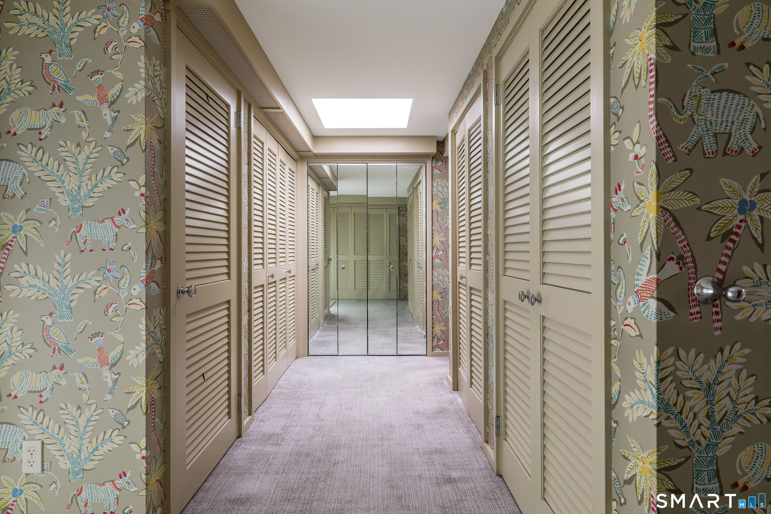 41 Watrous Point Road Old Saybrook, CT 06475 - Photo 29 of 40 a view of a hallway with wooden shelves
