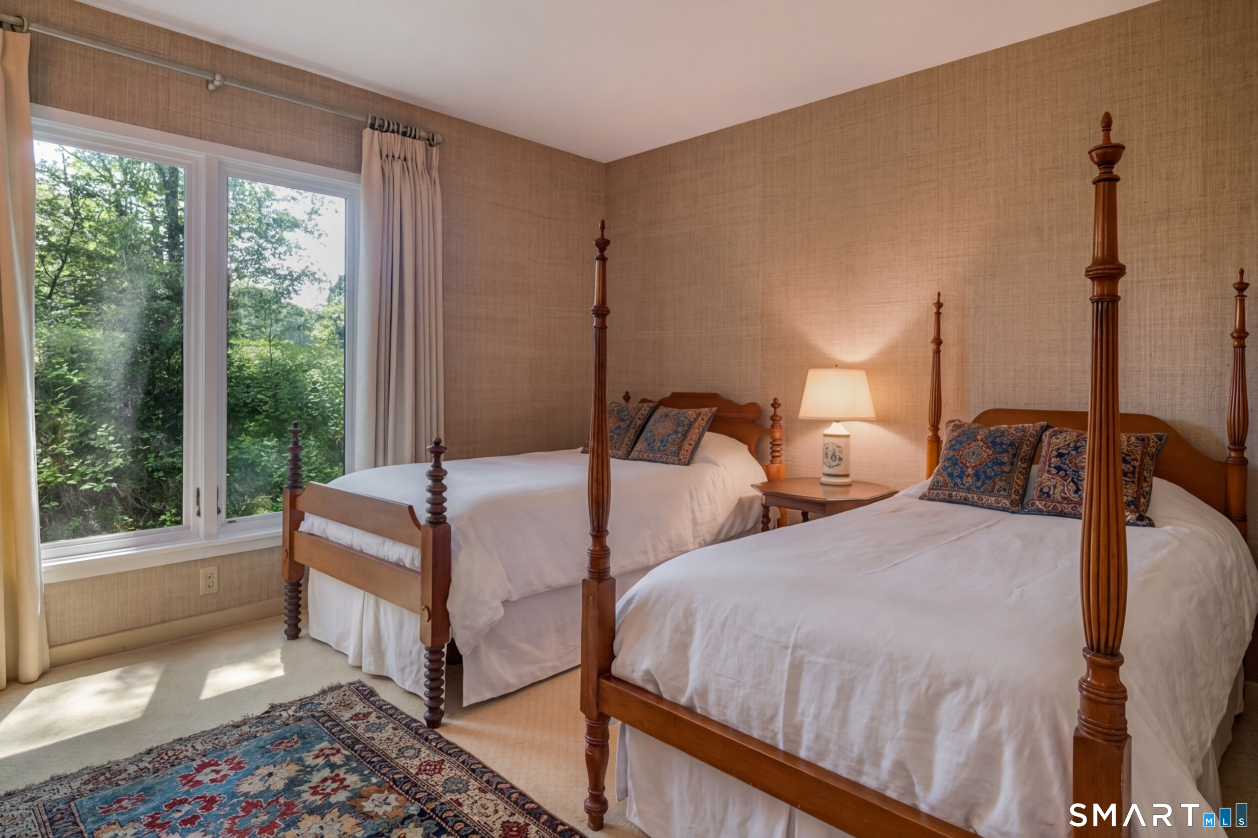 41 Watrous Point Road Old Saybrook, CT 06475 - Photo 39 of 40 a bedroom with two beds and large windows