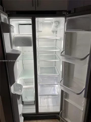 a bathroom with a sink mirror and a bath tub