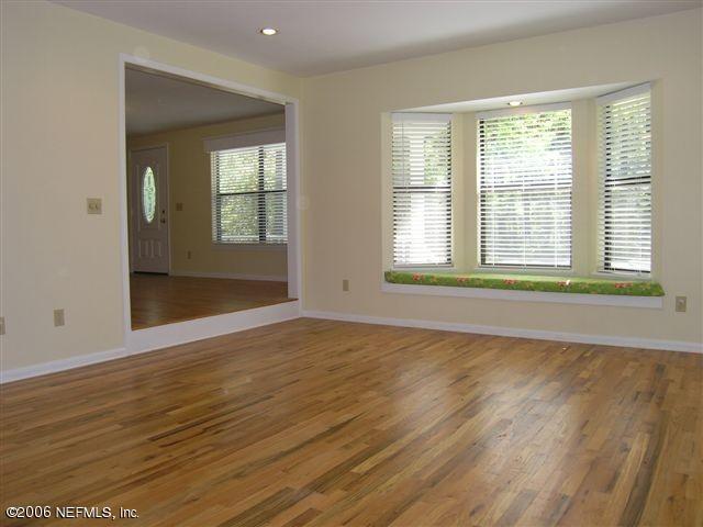 100 Cat Road Ponte Vedra Beach, FL 32082 - Photo 3 of 14 a view of an empty room with wooden floor and a window