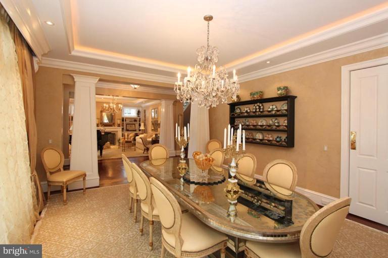 7402 Fairfax Road Bethesda, MD 20814 - Photo 2 of 30 a dining room with furniture and chandelier