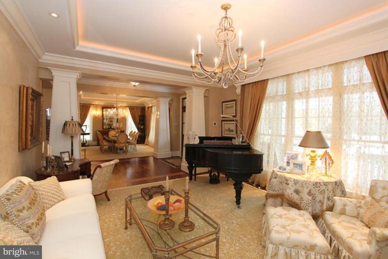 7402 Fairfax Road Bethesda, MD 20814 - Photo 3 of 30 a living room with furniture and a chandelier