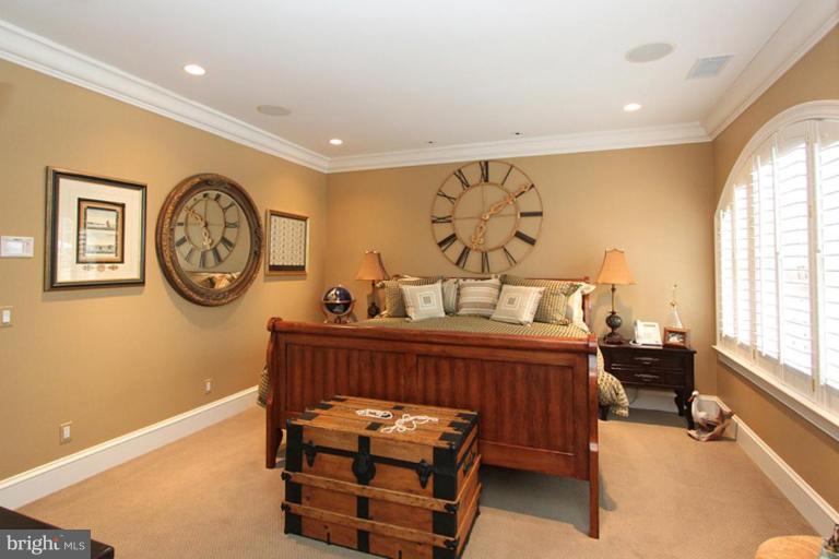 7402 Fairfax Road Bethesda, MD 20814 - Photo 21 of 30 a bedroom with a bed and a large window
