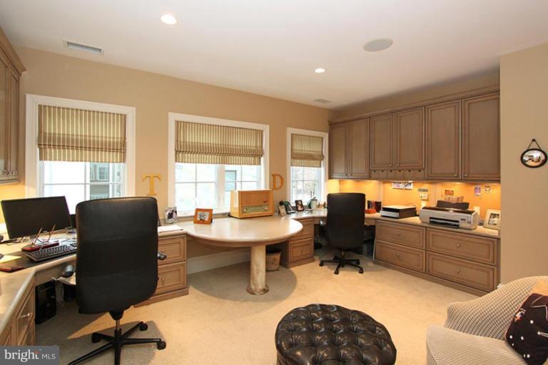 7402 Fairfax Road Bethesda, MD 20814 - Photo 24 of 30 a view of a workspace with furniture and a window