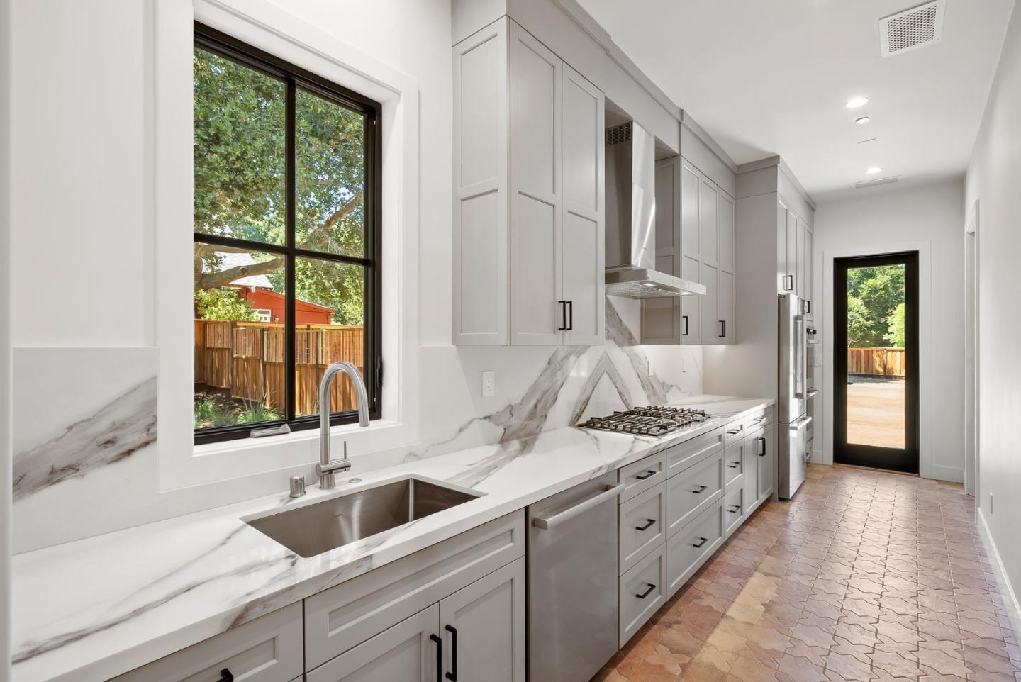 18521 Vessing Road Saratoga, CA 95070 - Photo 13 of 36 a spacious bathroom with double vanity and a large window