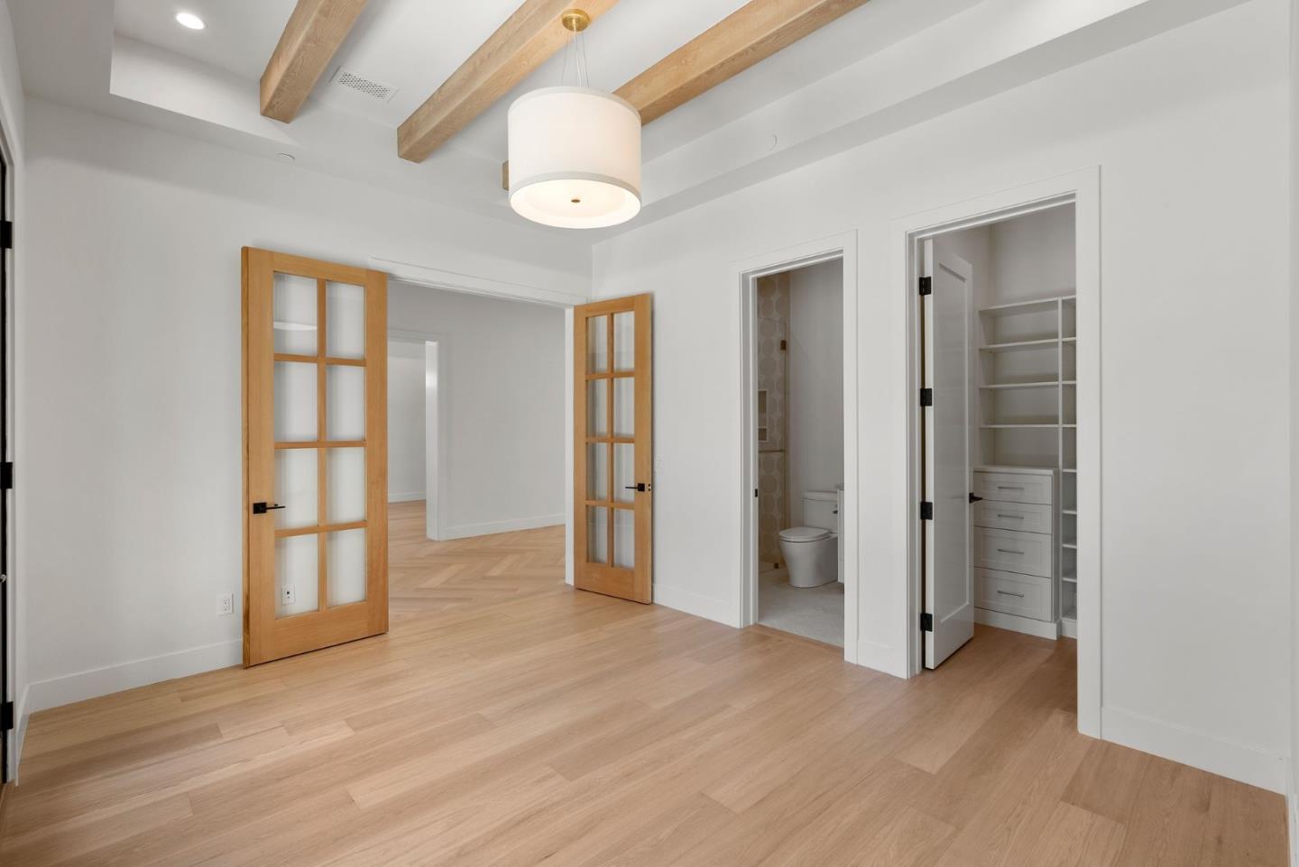 18521 Vessing Road Saratoga, CA 95070 - Photo 17 of 36 an empty room with wooden floor and windows