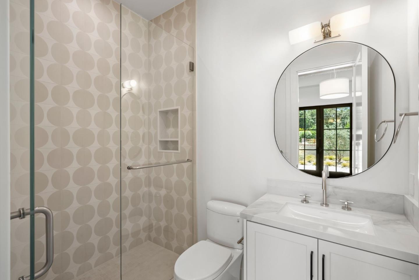 18521 Vessing Road Saratoga, CA 95070 - Photo 24 of 36 a bathroom with a toilet sink and mirror