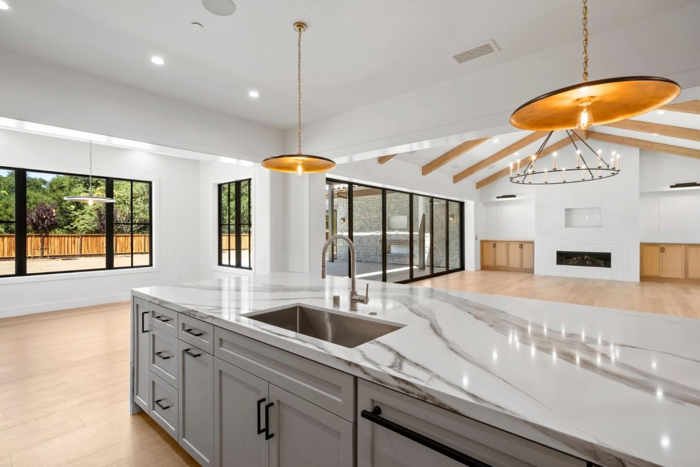 18521 Vessing Road Saratoga, CA 95070 - Photo 10 of 36 a kitchen with stainless steel appliances granite countertop a sink a oven and a large window