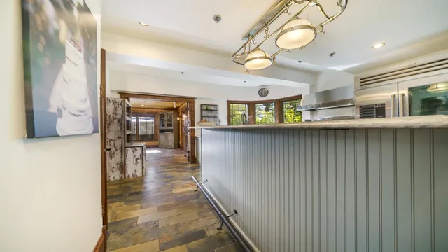 a spacious bedroom with a bed and a window