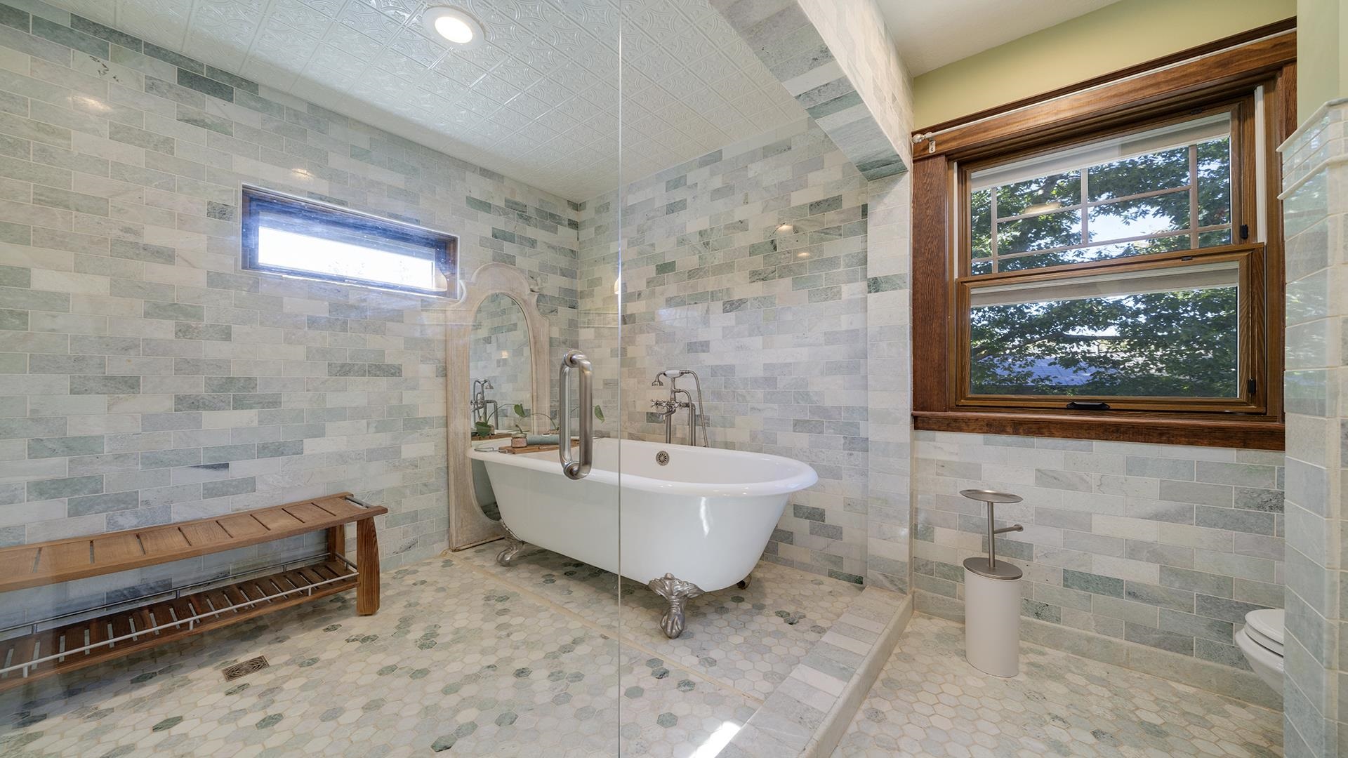 409 North State Street Franklin Grove, IL 61031 - Photo 4 of 98 a bathroom with a sink a bathtub and next to a window