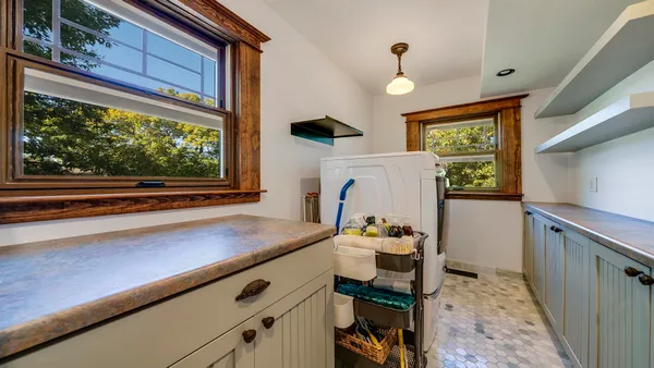 a bathroom with a toilet a sink and a mirror