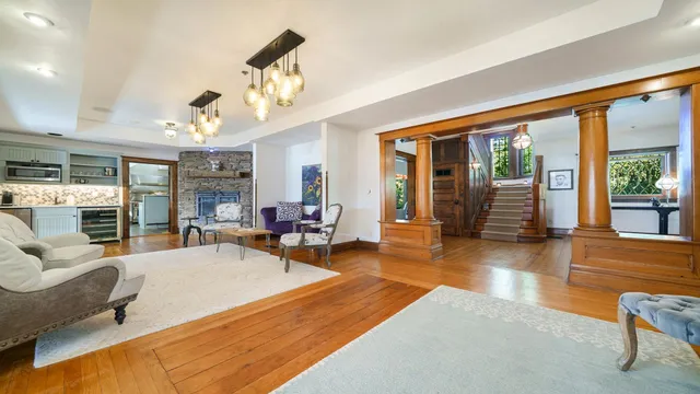 a view of a dining room with furniture window and wooden floor