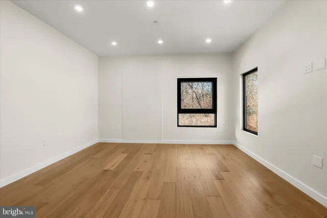 a view of a refrigerator in kitchen and wooden floor