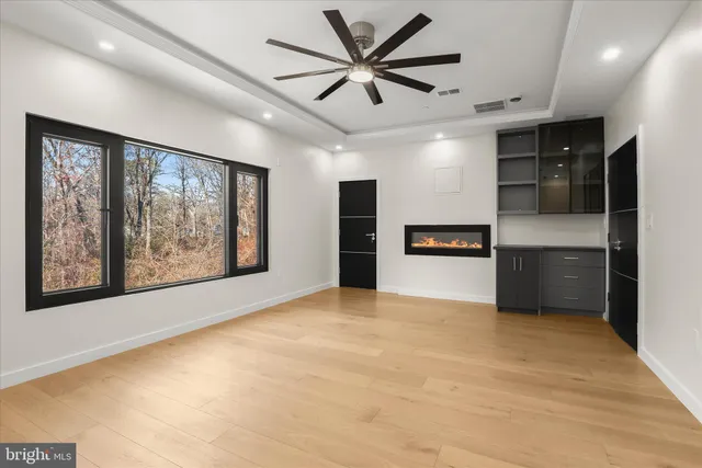 a bathroom with a granite countertop shower and a sink