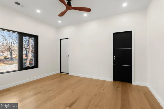 a kitchen with kitchen island a counter top space cabinets and stainless steel appliances
