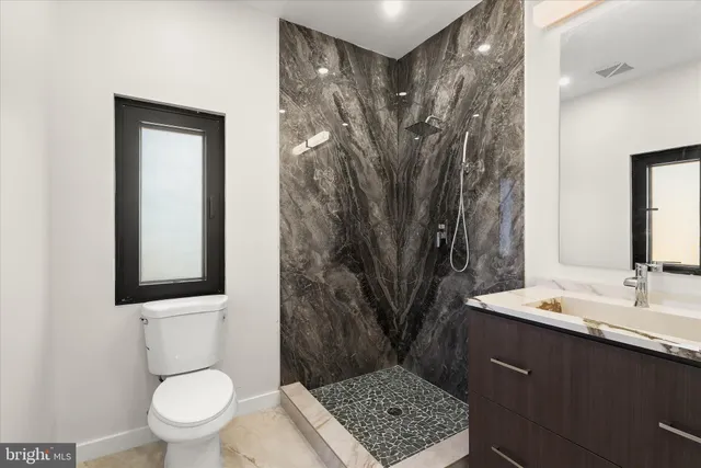 a kitchen with stainless steel appliances a stove and a refrigerator