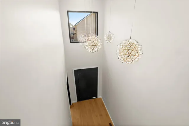 a view of a workspace with furniture and window