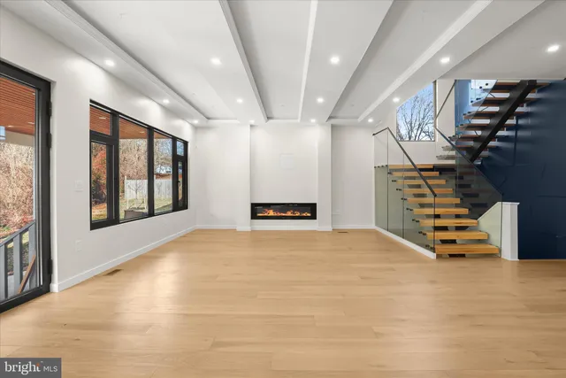a view of kitchen with refrigerator and window
