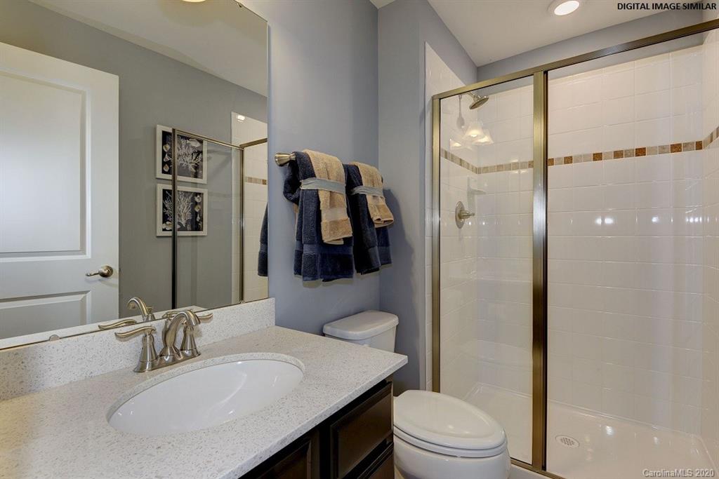 7111 Messina Road, Unit 128 Indian Land, SC 29707 - Photo 14 of 15 a bathroom with a sink toilet and shower