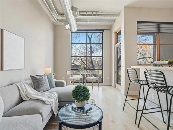 a living room with furniture and a large window
