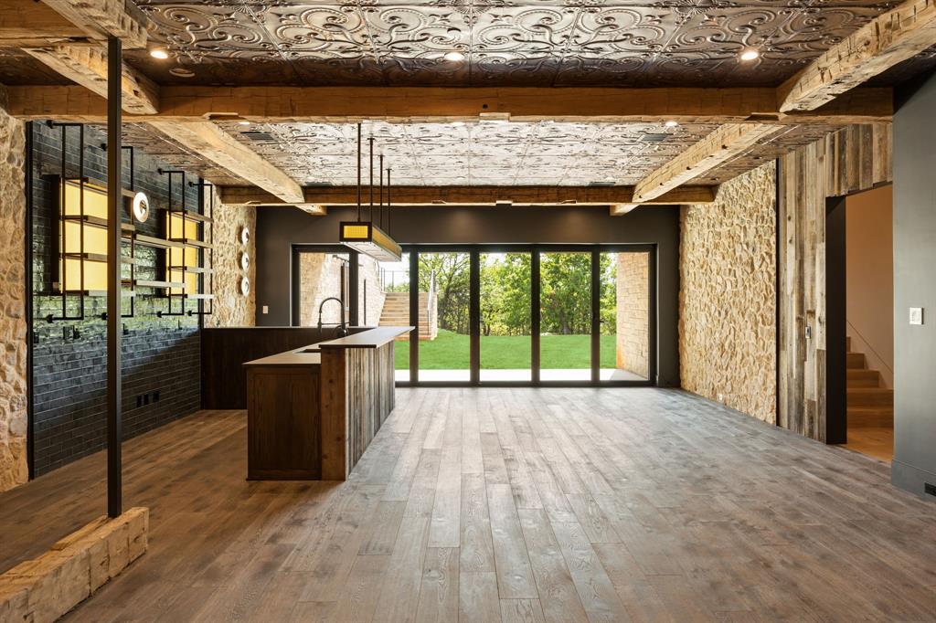 545 West Bob Jones Road Southlake, TX 76092 - Photo 27 of 40 a view of a room with wooden floor and iron stairs