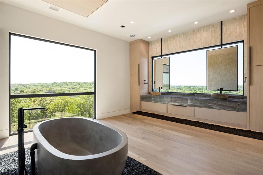 545 West Bob Jones Road Southlake, TX 76092 - Photo 34 of 40 a bathroom with a large tub and shower