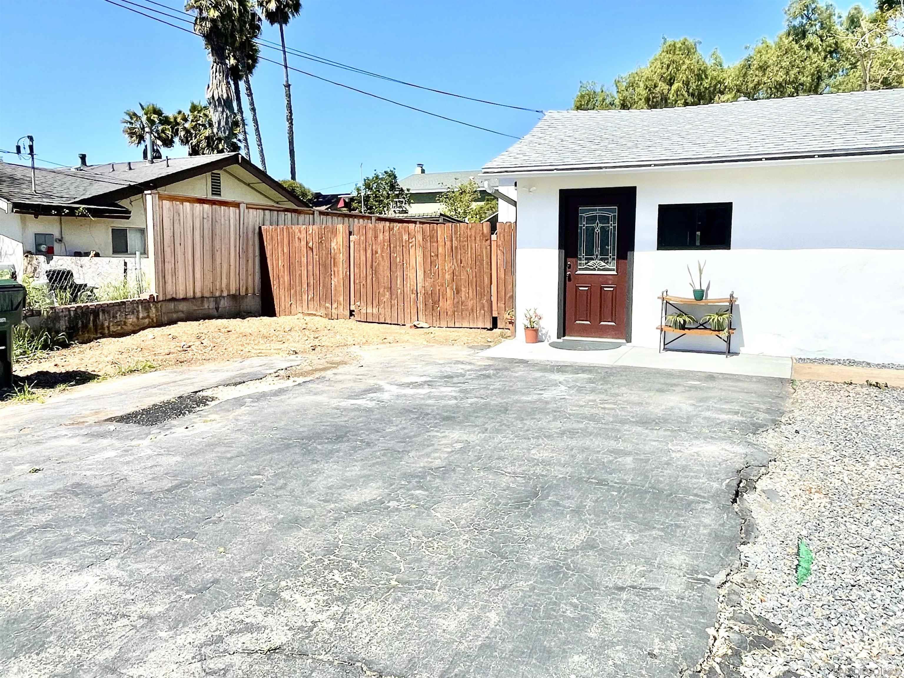1221 Rees Road Escondido, CA 92026 - Photo 2 of 7 a front view of a house with a garage