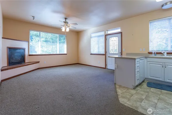 a view of a kitchen with a sink cabinets and a window