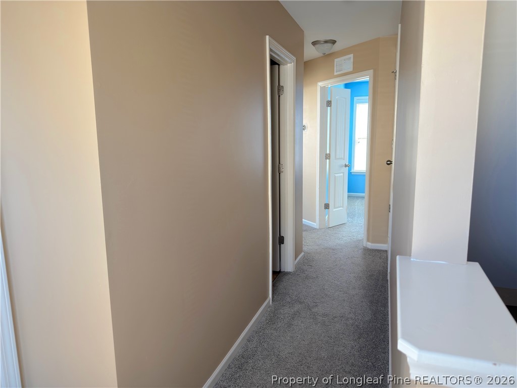 144 Bicentennial Way Cameron, NC 28326 - Photo 11 of 23 a view of a hallway with a room