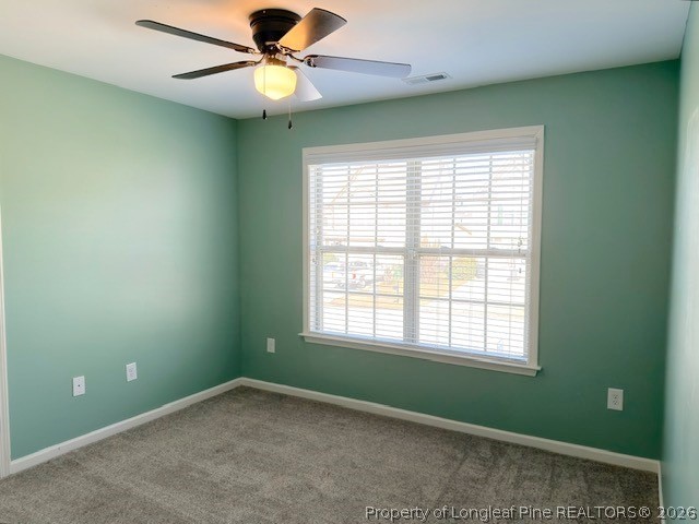 144 Bicentennial Way Cameron, NC 28326 - Photo 17 of 23 an empty room with a window and a fan