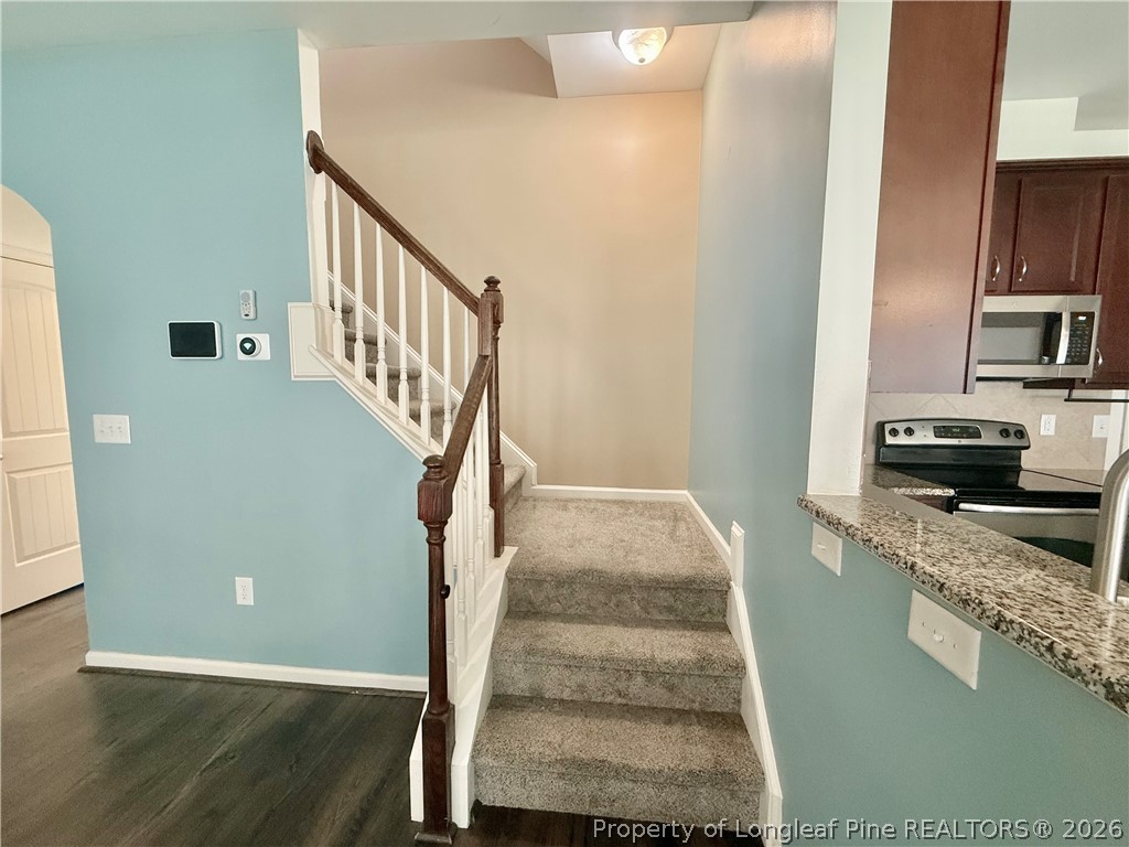 144 Bicentennial Way Cameron, NC 28326 - Photo 10 of 23 a view of a kitchen with cabinets and wooden floor