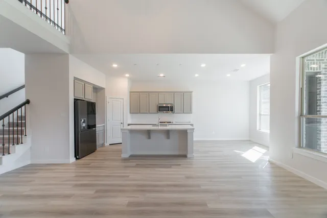 a view of kitchen with cabinets and stainless steel appliances