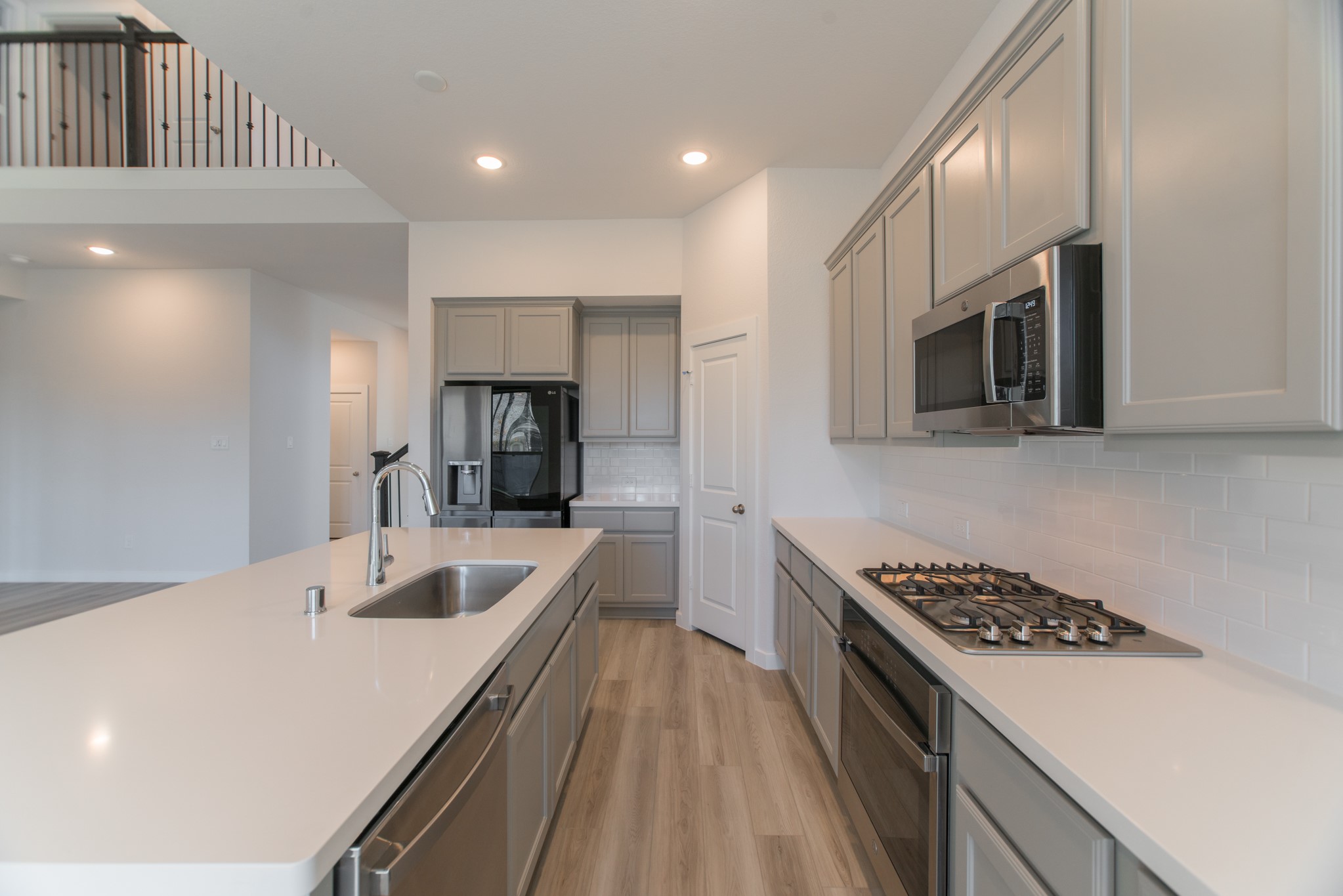 17138 Crimson Crest Drive Conroe, TX 77302 - Photo 19 of 50 a kitchen with counter top space stainless steel appliances and cabinets