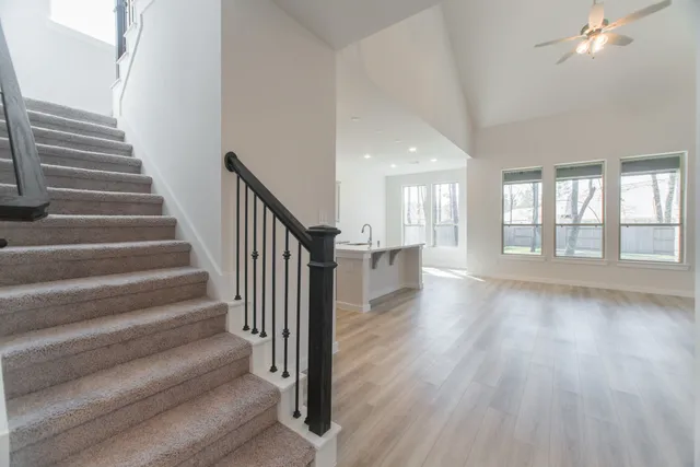 a view of an entryway with wooden floor