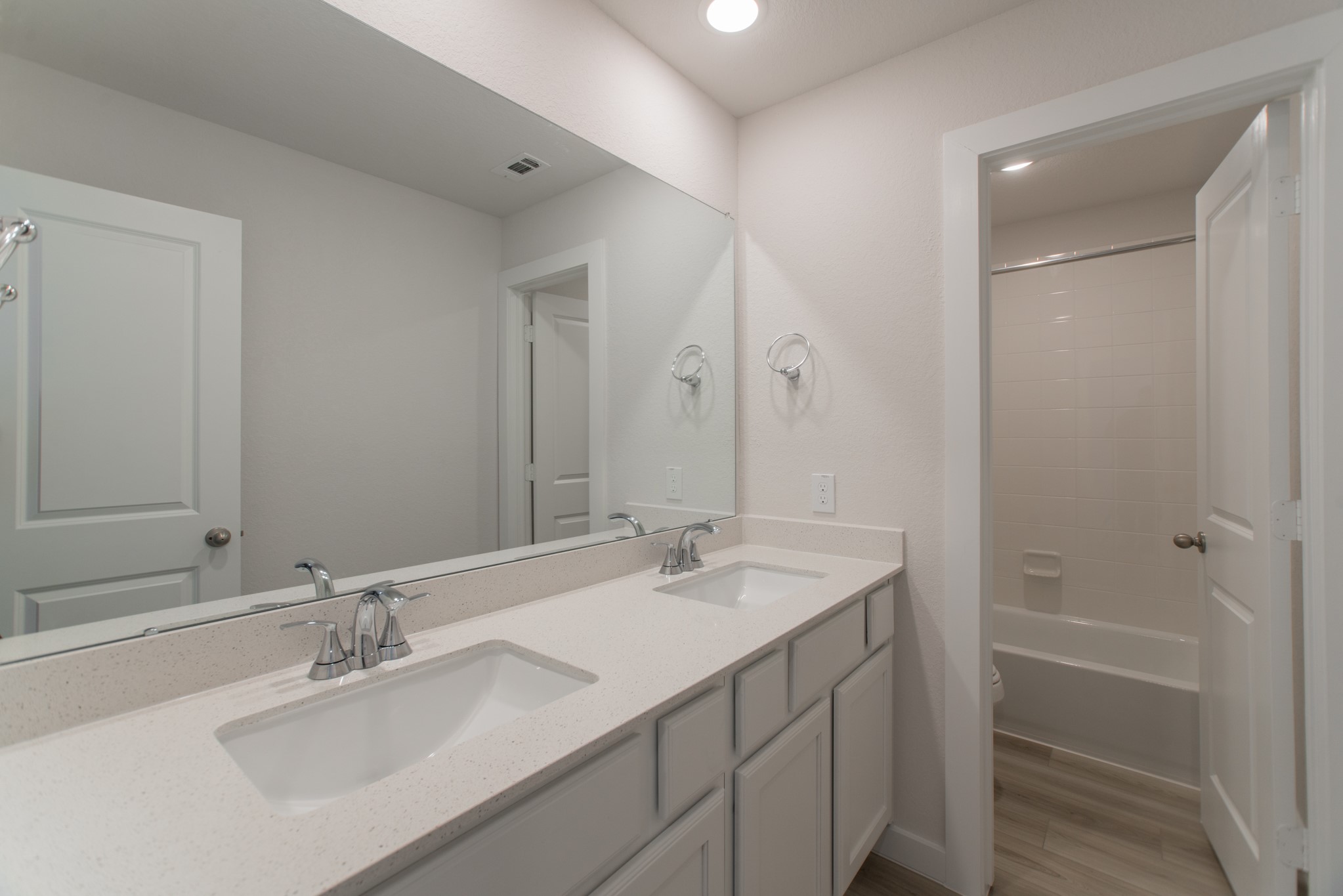 17138 Crimson Crest Drive Conroe, TX 77302 - Photo 35 of 50 a bathroom with a sink double vanity granite tub shower and a mirror