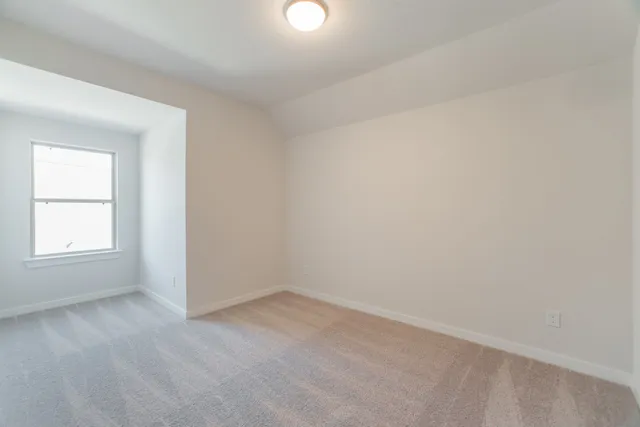 a bathroom with a bathtub shower sink vanity mirror and toilet