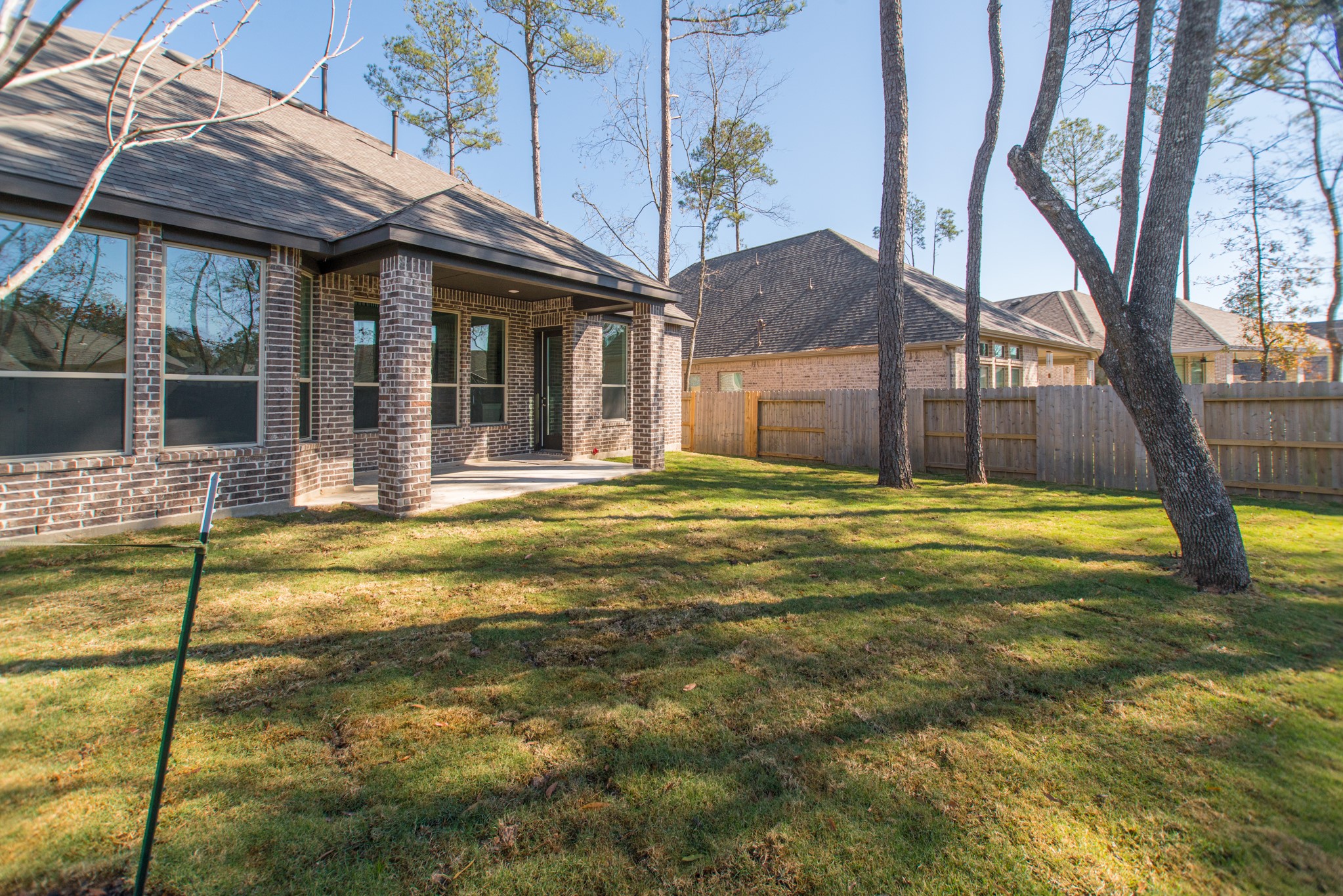 17138 Crimson Crest Drive Conroe, TX 77302 - Photo 43 of 50 a view of a house with a swimming pool