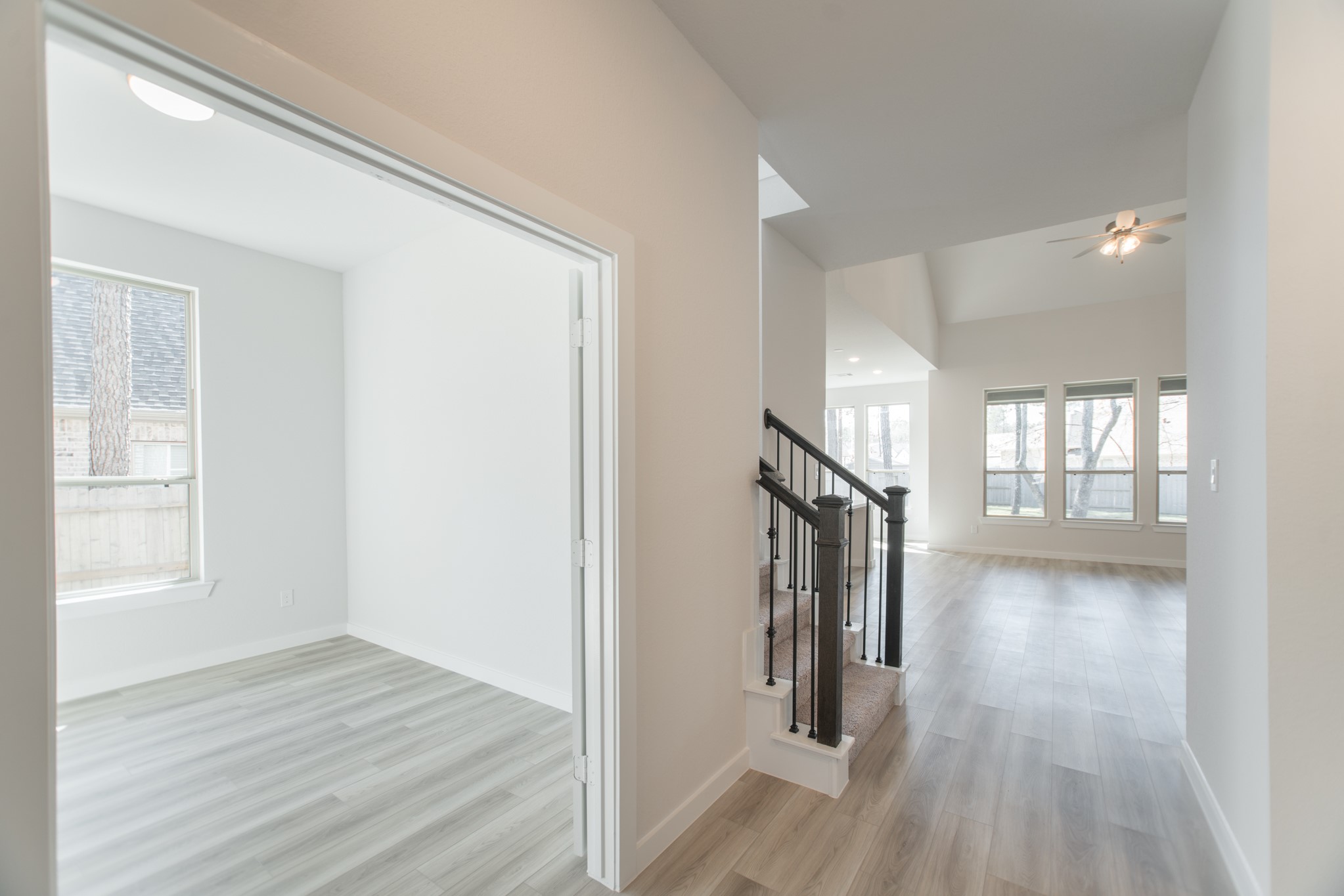 17138 Crimson Crest Drive Conroe, TX 77302 - Photo 5 of 50 a view of hallway with stairs and wooden floor