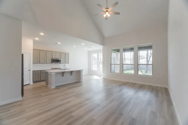 a view of a kitchen and kitchen island