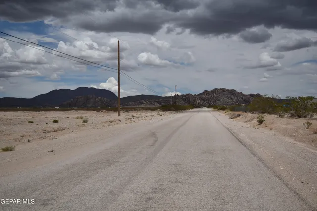 a view of a road with an ocean view