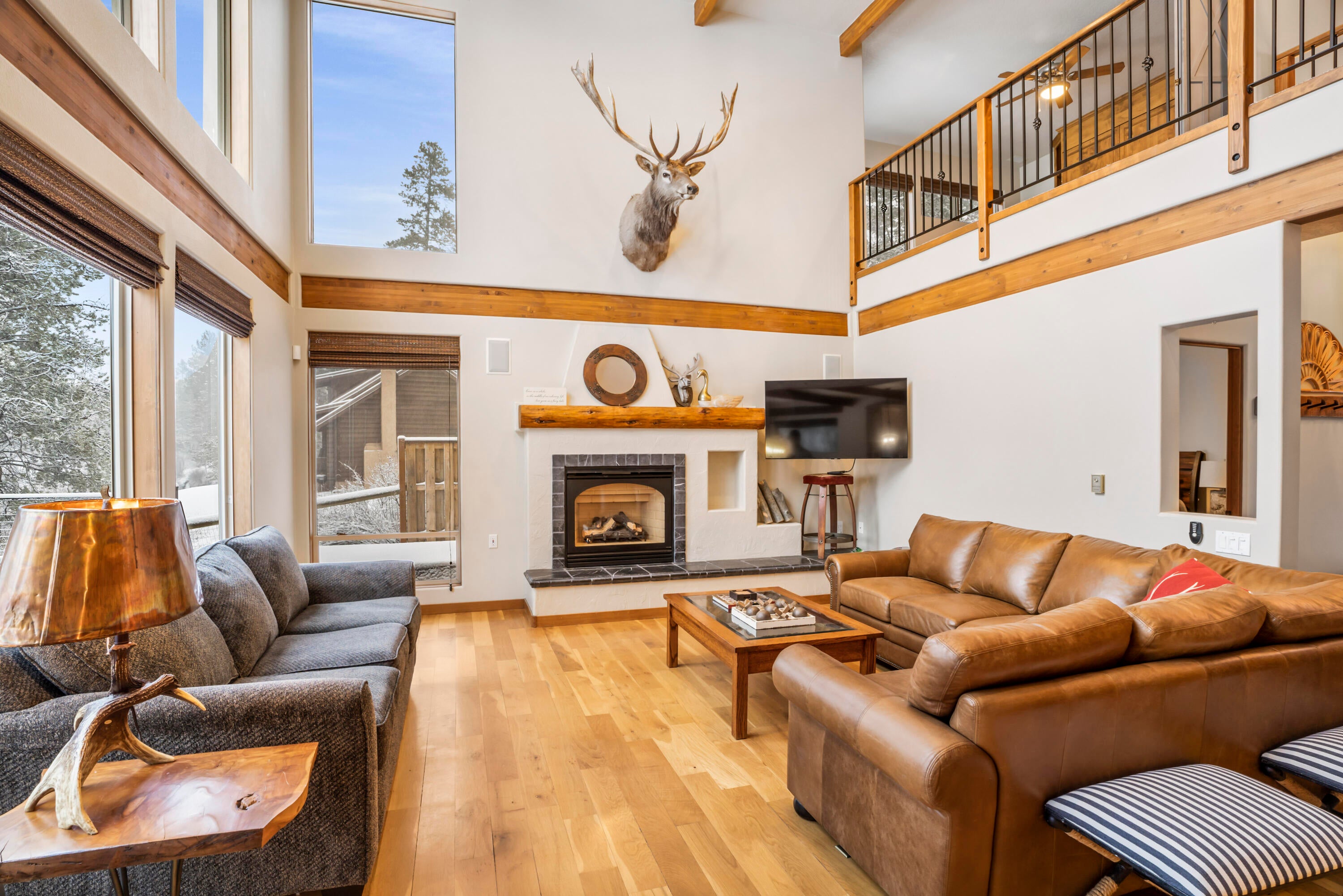 56065 Snow Goose Road Bend, OR 97707 - Photo 5 of 65 Exposed beams! Cozy living room! Fireplace, LG TV, Deschutes River Watching and relaxing!
