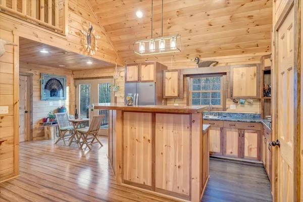 a kitchen with stainless steel appliances granite countertop a stove and a sink
